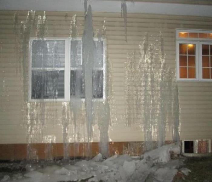 Ice sheets on siding of home