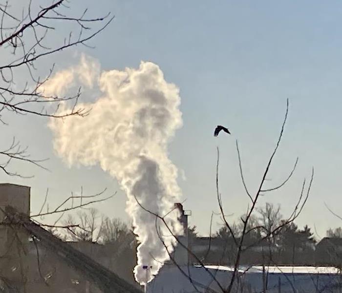 smoke against blue sky
