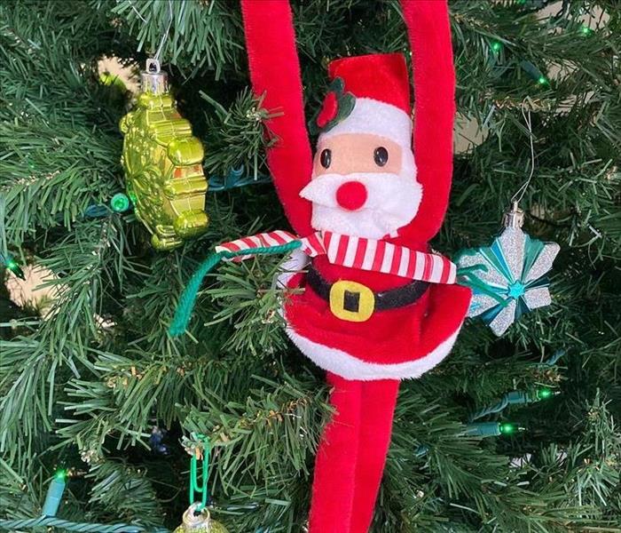 santa ornament on christmas tree