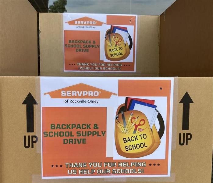 A cardboard box with School Supply flyers